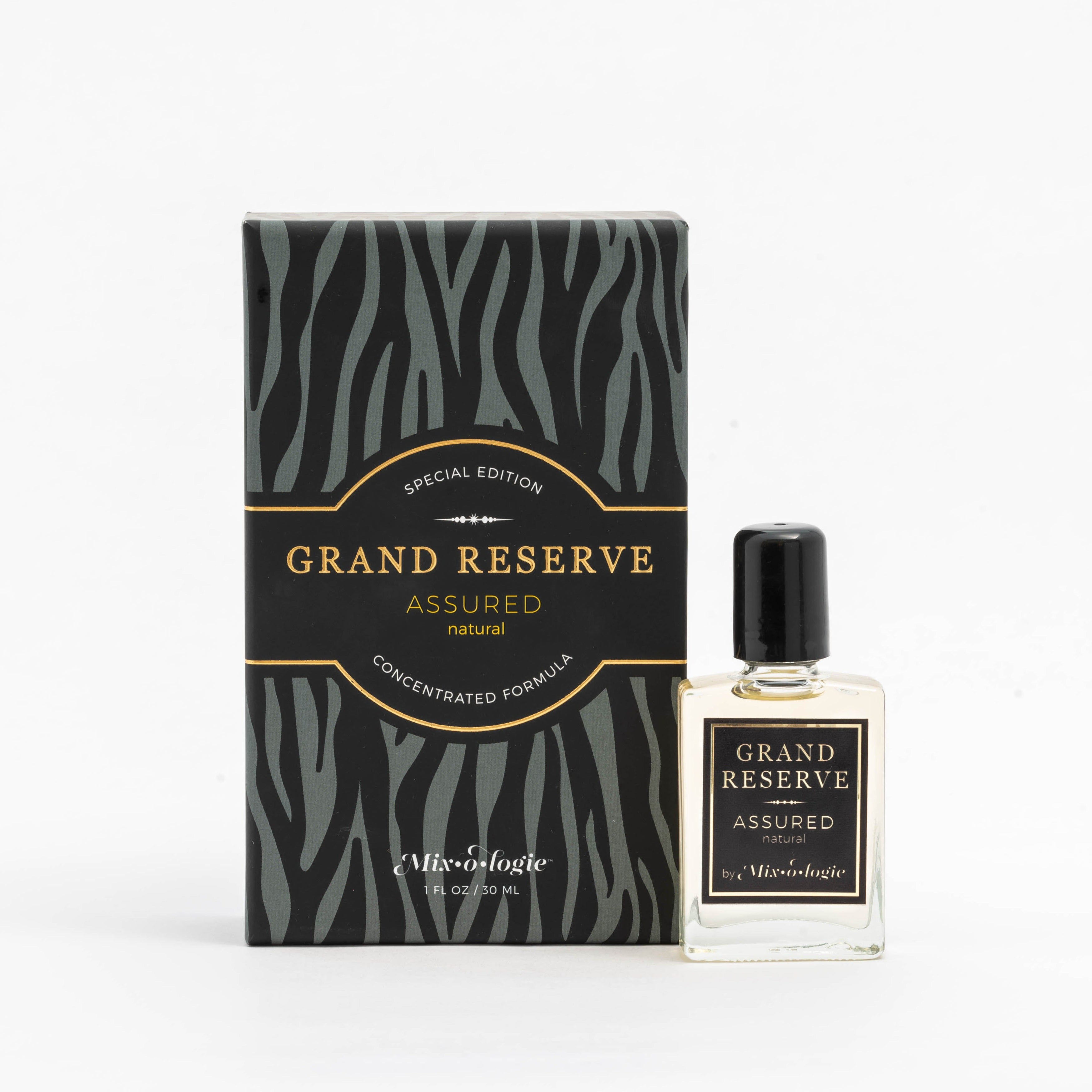 Assured (Natural) Special Edition Grand Reserve concentrated formula in clear glass rectangle perfume bottle that has 1 fl oz or 30 mL of light-yellow liquid with black cap, label, and spray nozzle. Black zebra pattern rectangle box with mustard letting. Grand Reserve and box pictured with white background.