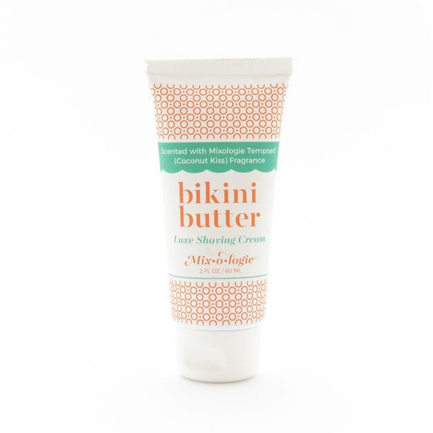 Luxe Shaving Cream Bikini Cutter scented with Mixologie Tempted (Coconut Kiss) Fragrance in a 2 fl oz or 60 mL white tube with orange circle pattern and white cap. Bikini Butter pictured with white background.