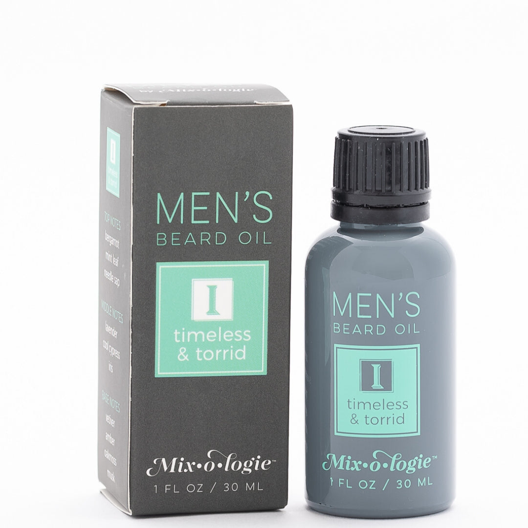 Men’s Beard Oil in Men’s I (Timeless & Torrid) in a black and grey tube with green accents. 1 fl oz or 30 mL. Pictured on white background.