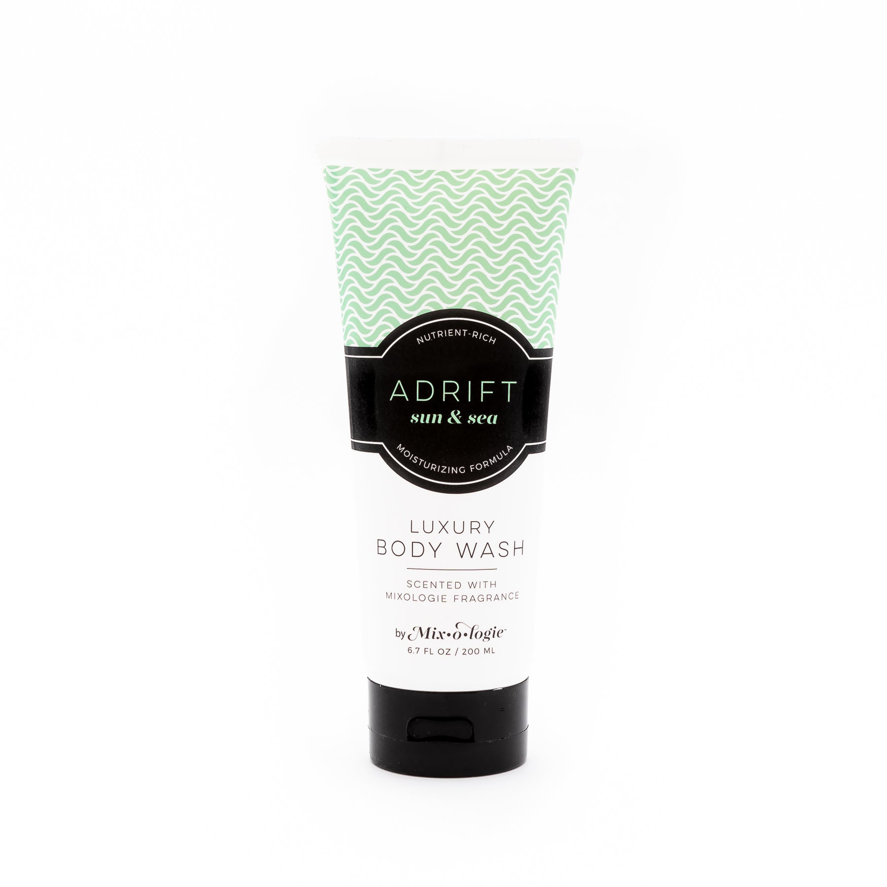 Luxury Body Wash in Mixologie’s Adrift (Sun & Sea) in light green color sample package with black label. Contains 6.7 fl oz or 200 mL pictured on a white background. 