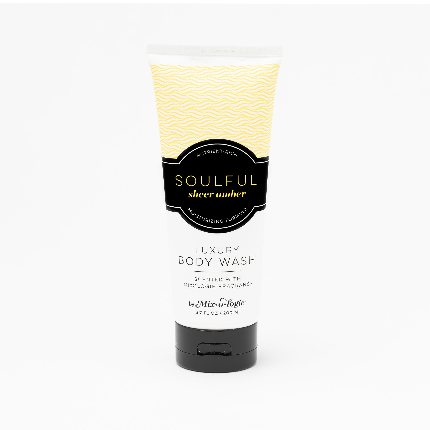 Luxury Body Wash in Mixologie’s Soulful (Sheer Amber) in bright yellow color sample package with black label. Contains 6.7 fl oz or 200 mL pictured on a white background. 
