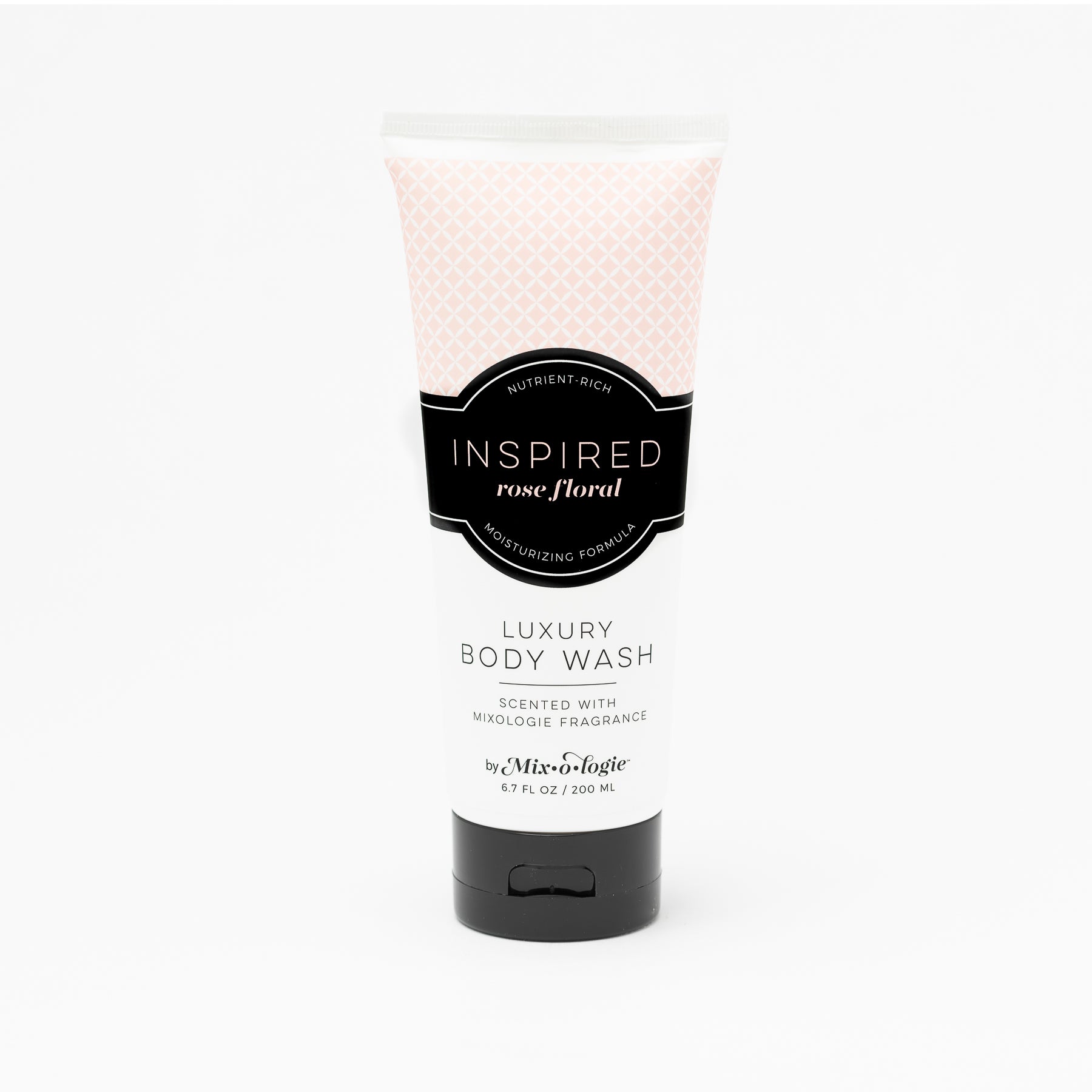 Luxury Body Wash in Mixologie’s Inspired (Rose Floral) in pale pink color sample package with black label. Contains 6.7 fl oz or 200 mL pictured on a white background. 