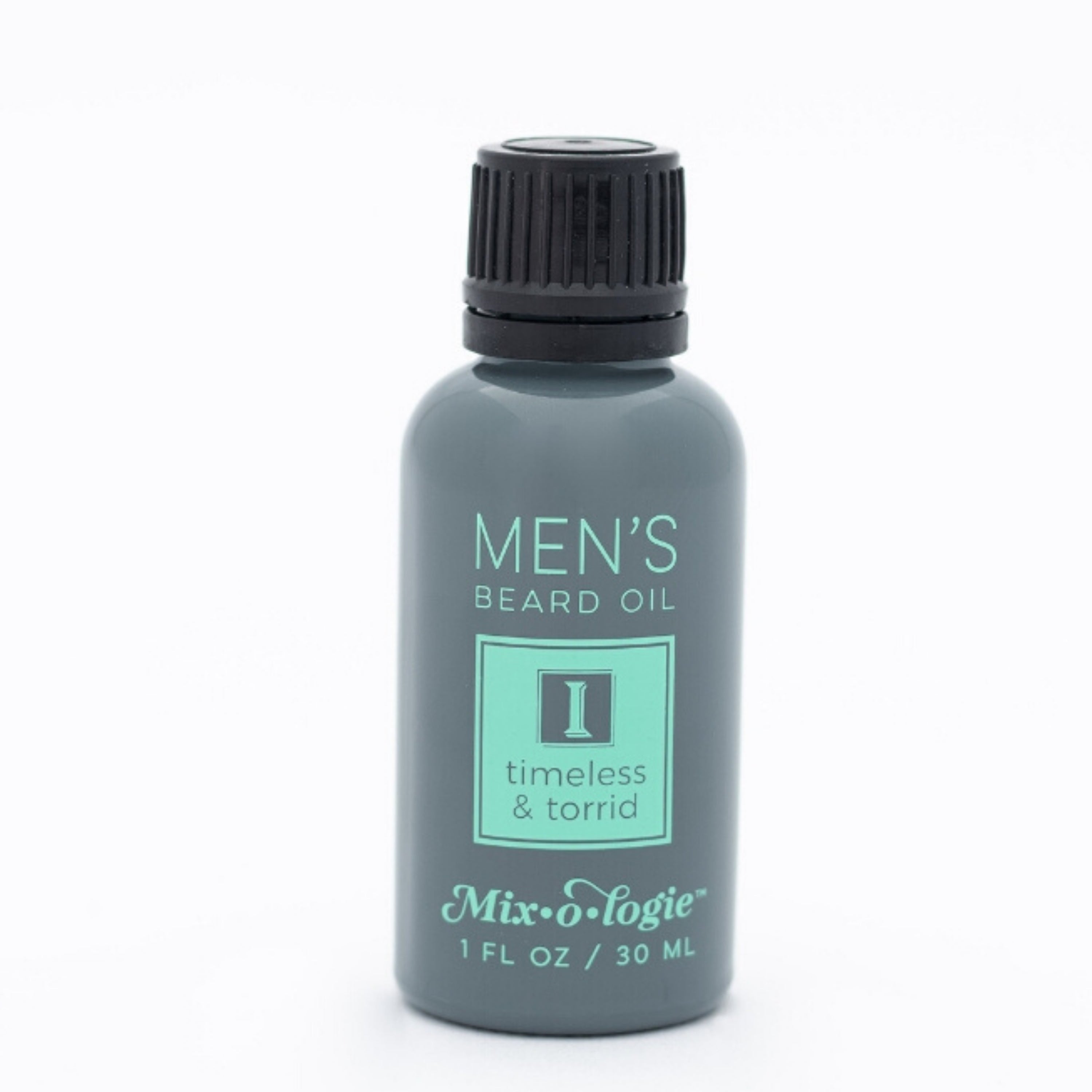 Men’s Beard Oil in Men’s I (Timeless & Torrid) in a black and grey tube with green accents. 1 fl oz or 30 mL. Pictured on white background.