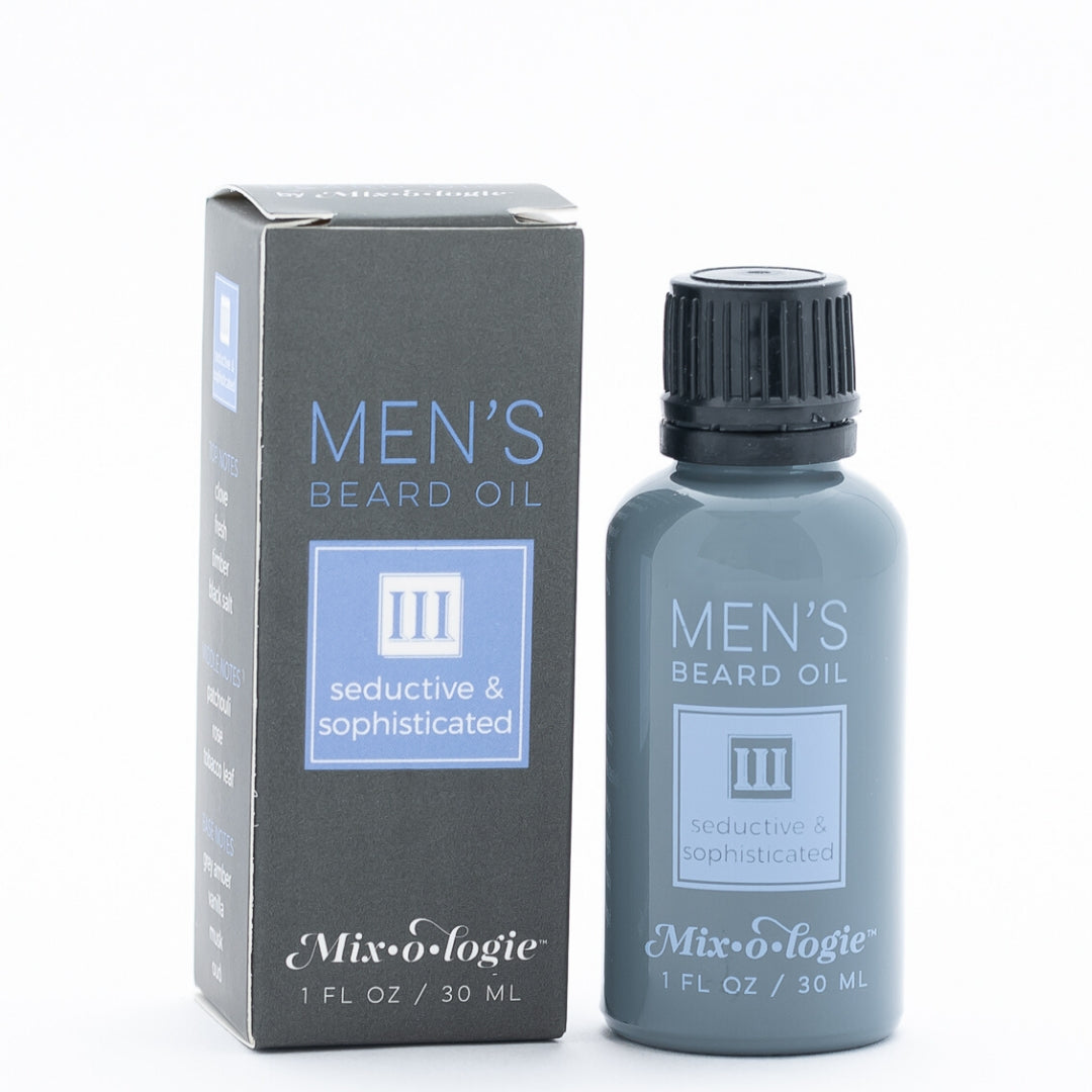 Men’s Beard Oil in Men’s III (Seductive & Sophisticated) in a black and grey bottle with blue colored accents. 1 fl oz or 30 mL. Pictured on white background,