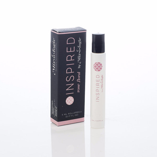 Inspired (Rose Floral) white cylinder rollerball with pale pink color lettering with black box and pale pink color lettering. Rollerball has 0.17 fl oz or 5 mL. Rollerball and rollerball box pictured on white background.