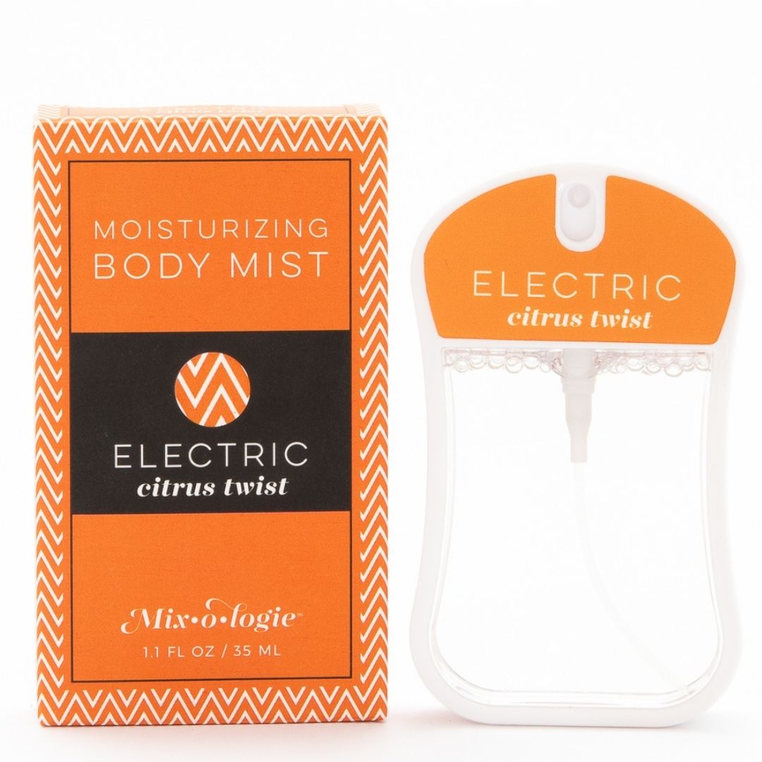 Electric (Citrus Twist) Moisturizing Body Mist in orange color box and rounded rectangle spray bottle with orange color label and clear liquid. Spray bottle has 1.1 fl oz or 35 ML. Spray bottle and box are pictured on a white background.